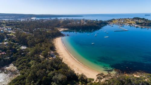 an aerial view of a beach with boats in the water at Eden Motel in Eden