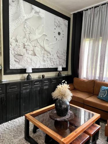 a living room with a couch and a table at 17 Riada Villa in San Juan