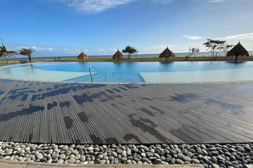 a large swimming pool with rocks around it at 17 Riada Villa in San Juan