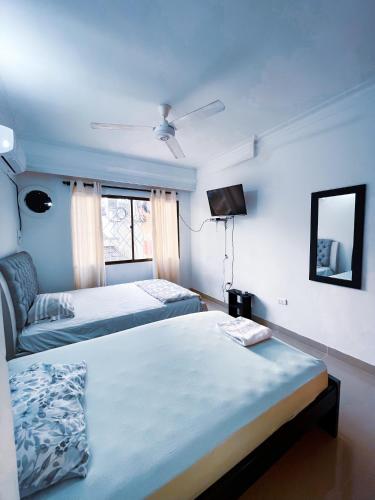 En eller flere senge i et værelse på Casa a una cuadra del mar