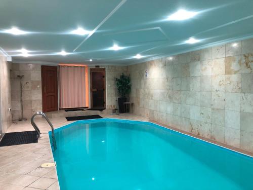 a swimming pool in a room with at Meduza Wellness Spa in Hlohovec