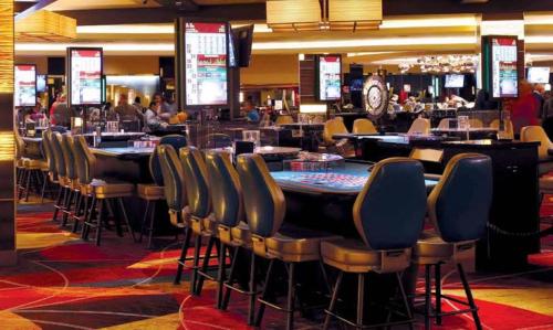 a bar with chairs and tables in a casino at Tropicana Atlantic City, A Caesars Destination in Atlantic City