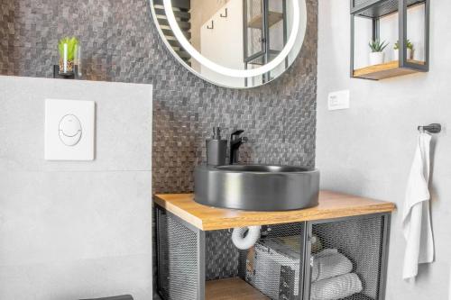 a bathroom with a sink and a mirror at Apartment Ladan in Trogir