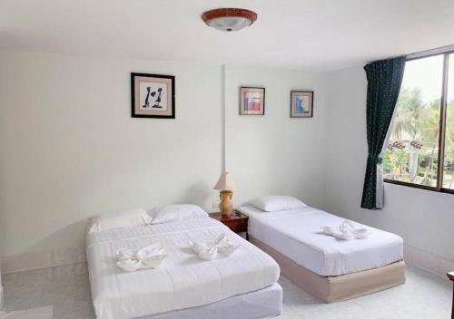 Кровать или кровати в номере Joys cafe & Guesthouse