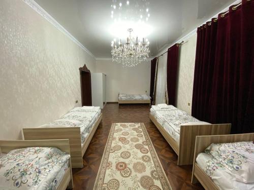 Un ou plusieurs lits dans un hébergement de l'établissement Sultan Sarai Osh