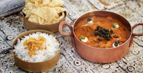 three bowls of food with rice and tortilla chips at The Ritz-Carlton Maldives, Fari Islands in North Male Atoll
