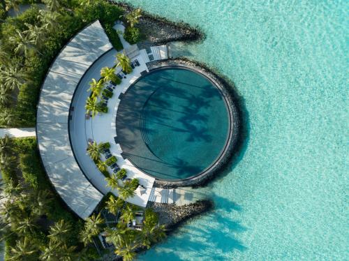 an aerial view of a resort in the ocean at The Ritz-Carlton Maldives, Fari Islands in North Male Atoll