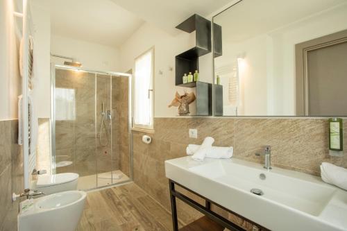 Ванная комната в Riva Toscana Golf Resort & SPA