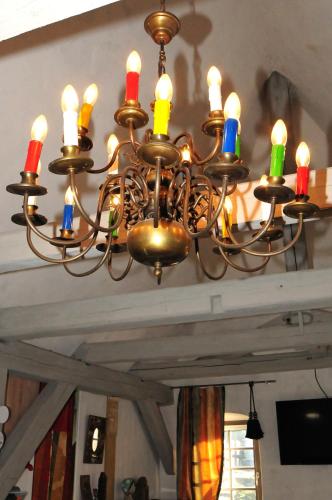 a chandelier with colorful candles on a ceiling at Holzwerk Oybin in Kurort Oybin