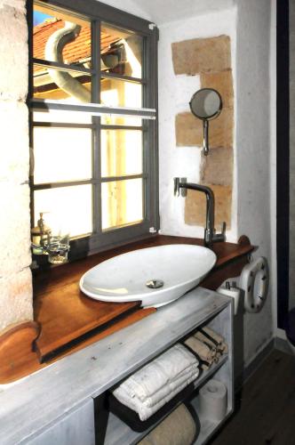 a bathroom with a sink and a window at Holzwerk Oybin in Kurort Oybin