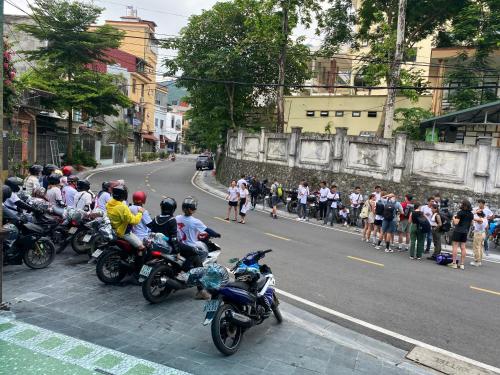 a group of motorcycles parked on the side of a street at Sun Hà Giang Hotel-tours-motorbike rental in Ha Giang
