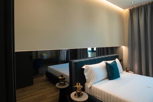 Una cama o camas en una habitación de Vlore Luxury Apartaments "FAEL"