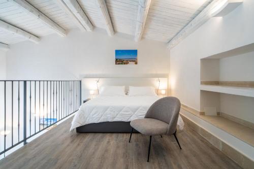 Un pat sau paturi într-o cameră la Borgo Vita Novella