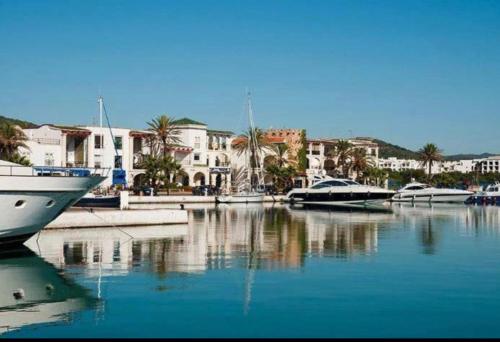 a group of boats docked in a marina with buildings at SMIR PARK apartment Mdi'q , Marina smir, Oceanica in Marina Smir