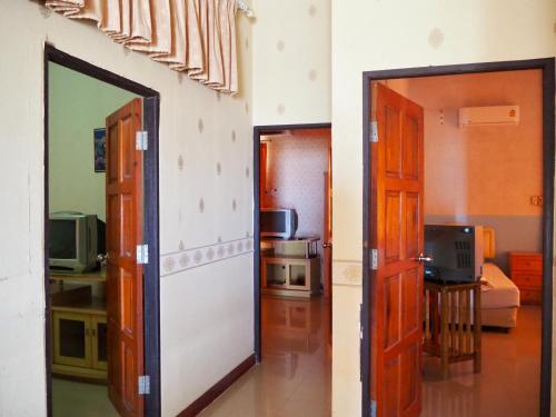 two doors in a room with a living room at Onthebeach resort in Ban Hin Sam Kon