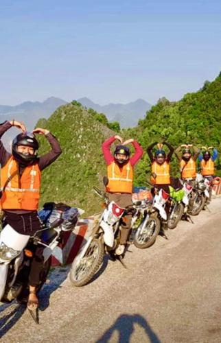 a group of people on motorcycles on a road at Sun Hà Giang Hotel-tours-motorbike rental in Ha Giang