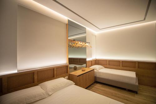Una cama o camas en una habitación de Vlore Luxury Apartaments "FAEL"