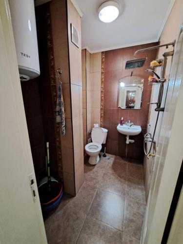 a bathroom with a toilet and a sink at encanto in Plovdiv