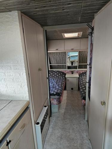 an interior view of an rv with couches at Каравана ИГЛАНД in Chernomorets