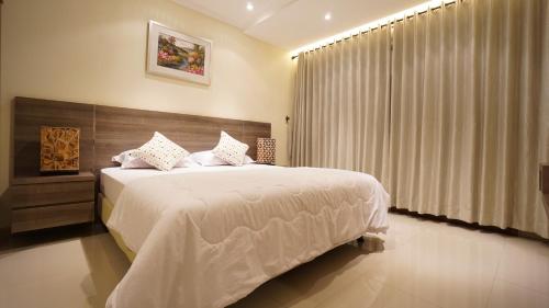 Кровать или кровати в номере De Reiz Villa Kesuma Syariah