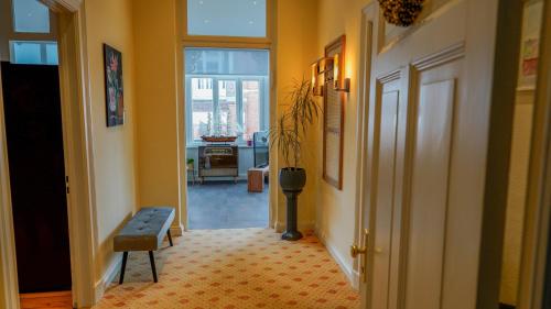a hallway with a door leading to a living room at Ferienwohnung Bubikat in Borkum