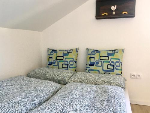 a bedroom with two beds and a picture on the wall at Swiss View in Hohentengen
