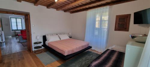 Postel nebo postele na pokoji v ubytování Casa Vacanza Ex Pretura Vallelaghi