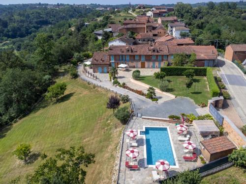an aerial view of a house with a swimming pool at Holiday Home Bricco delle Rondini by Interhome in Villata