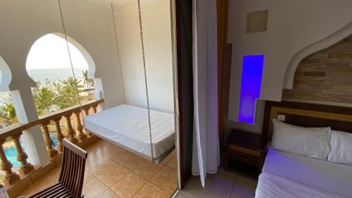 Ein Bett oder Betten in einem Zimmer der Unterkunft Shanzu Seabreeze Apartments
