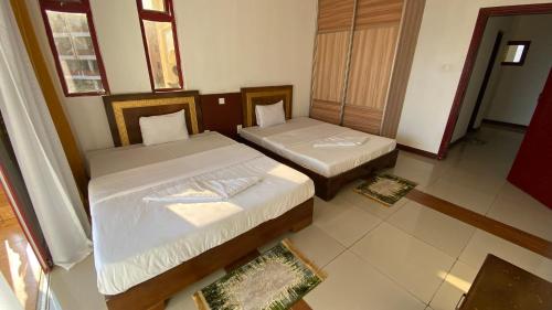 Ein Bett oder Betten in einem Zimmer der Unterkunft Shanzu Seabreeze Apartments
