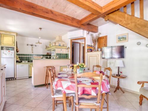 a kitchen and dining room with a table and chairs at Holiday Home Le Brulat by Interhome in Le Castellet