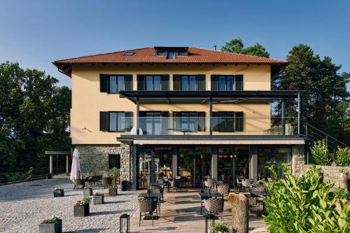 a large building with tables and chairs in front of it at Hotel Republika in Zagreb