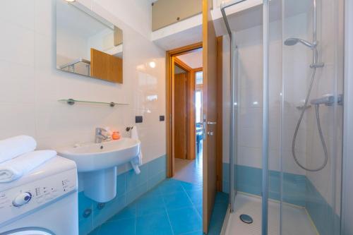 a bathroom with a sink and a shower at Residence degli Oleandri 2A in Argegno