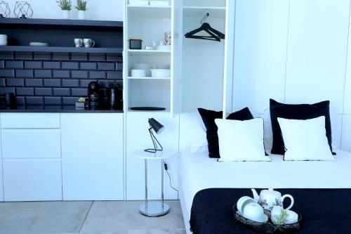 a bedroom with a bed with a black and white at Condessa Home in Ponta Delgada