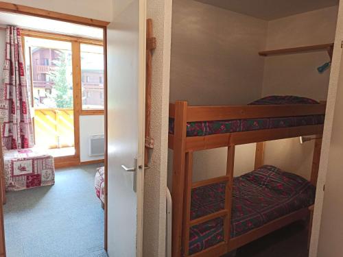 Ένα ή περισσότερα κρεβάτια σε δωμάτιο στο Paradiski proche pistes vallandry