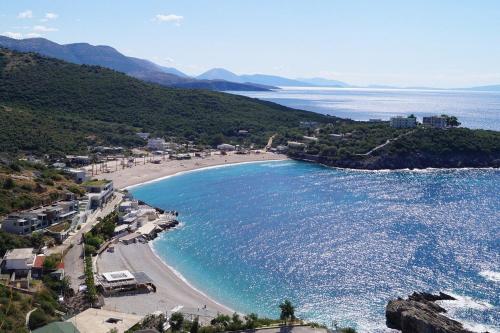 an aerial view of a beach and the ocean at Mia Marine Rooms in Himare