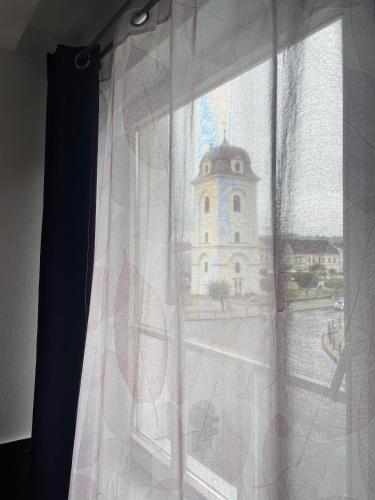 a view of a building from a window at Hotel Ďumbier in Brezno