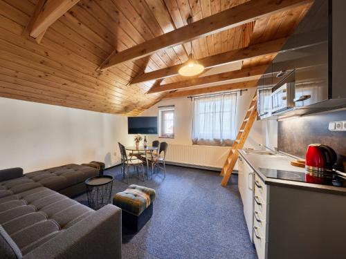 a living room with a couch and a table at Apartment Marika 2 by Interhome in Cerny Dul