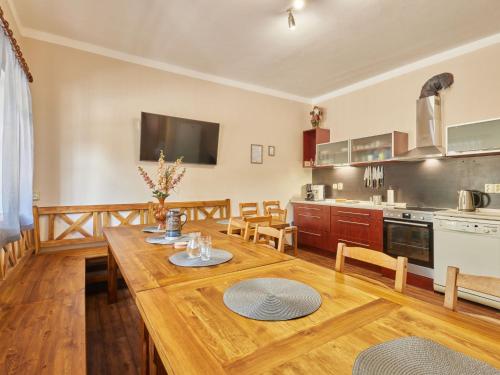 a kitchen and dining room with a wooden table at Holiday Home Marika by Interhome in Cerny Dul