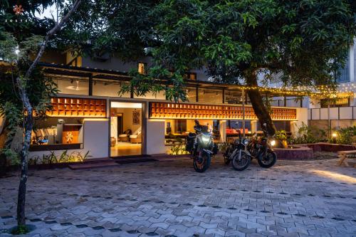 two motorcycles parked in front of a building at Zostel Kochi (Ernakulam) in Ernakulam