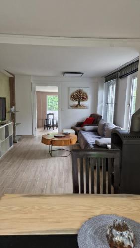 a living room with a couch and a table at Hasenbau Flüren in Wesel
