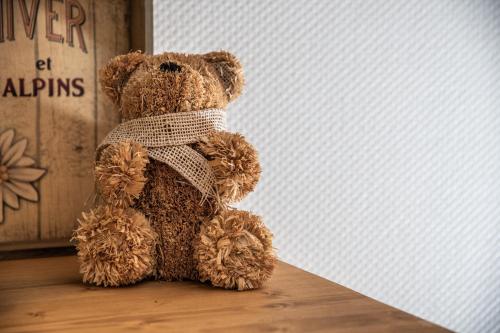 a teddy bear sitting next to a wall at Au Rêve Savoyard 7 - 4 personnes in Morillon