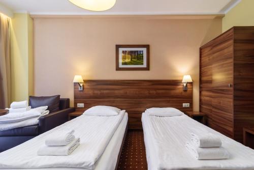 Postel nebo postele na pokoji v ubytování Hotel Podium