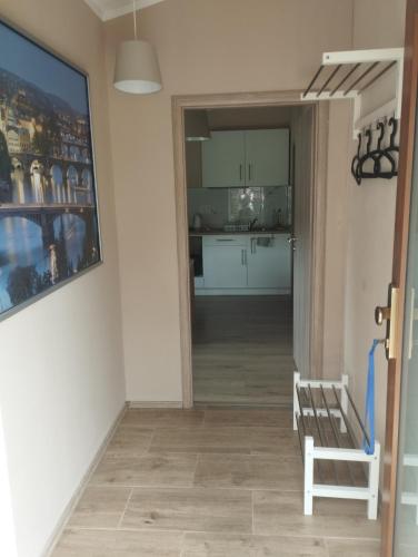 a hallway with a view of a kitchen in a house at Apartmány Audy 2 in Mníšek pod Brdy