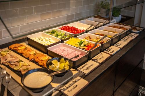 a buffet with different types of food on a table at BollAnts Spa im Park in Bad Sobernheim
