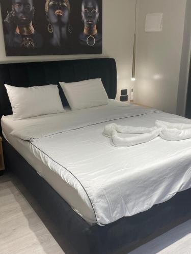 Ένα ή περισσότερα κρεβάτια σε δωμάτιο στο South Star Suites