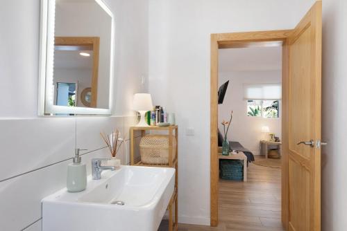 a bathroom with a sink and a mirror at Villa Tino- Casa D in Los Llanos de Aridane