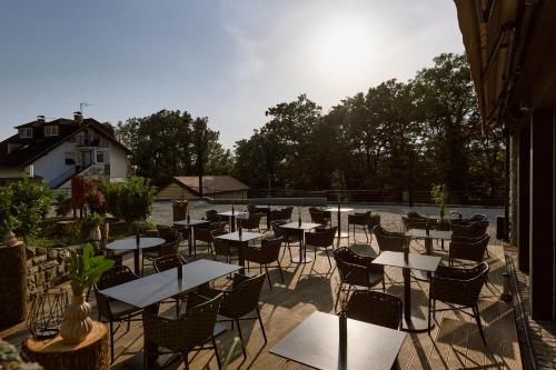 a group of tables and chairs on a patio at Hotel REPUBLIKA in Zagreb