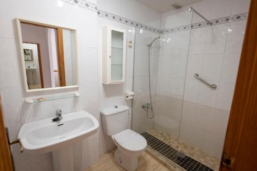 a bathroom with a toilet and a sink and a shower at Destinos De Sol Los Alcazares - Montepío Minería in Los Alcázares