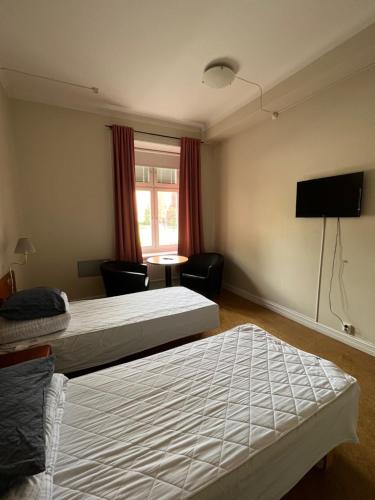 Una cama o camas en una habitación de Carlstad Sport Hostel